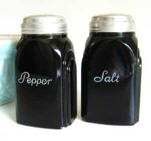 Black Glass Salt & Pepper Shakers: Black/dark green McKee salt and pepper shakers with art deco styling. Sides of shakers are Roman Arch shaped. Sold on Etsy and seen elsewhere for $50 and up.