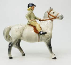 Rare Beswick model of a girl on grey pony 1499 with light green jacket – top auction estimate was $1,000, sold for $1,600 in 2018.