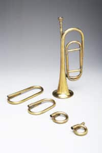 Bugle in G made in the early 19th century. During the War of 1812, there was a variety of shapes and sizes of the bugle. Typical shapes included the coiled, half-moon, and the elongated coil similar to the one shown. During the war, the bugle was included in the major U.S. military music ensembles. photo: Yale School of Music