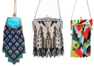 Trio of mesh purses by Whiting and Davis (from l-r) a compact purse with Guilloche enamel compact top; iconic skyline of New York; and enameled color using the Cubist style