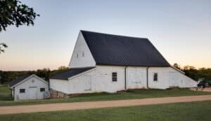The 18th century threshing barn at Clover Hill in Albemarle County, Virginia. While slightly modified over time, the building essentially stands as it did when Thomas Jefferson visited in 1796 to view the wheat threshing machine installed by William Douglas Meriwether. photo: Jennifer Wilkoski, 2017