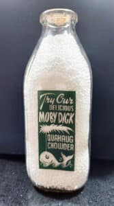 A unique ad on a square milk bottle from Gulf Hill Farm, South Dartmouth, MA – for clam chowder! It won the People’s Choice Award for most unusual design at a NAMBC Convention.