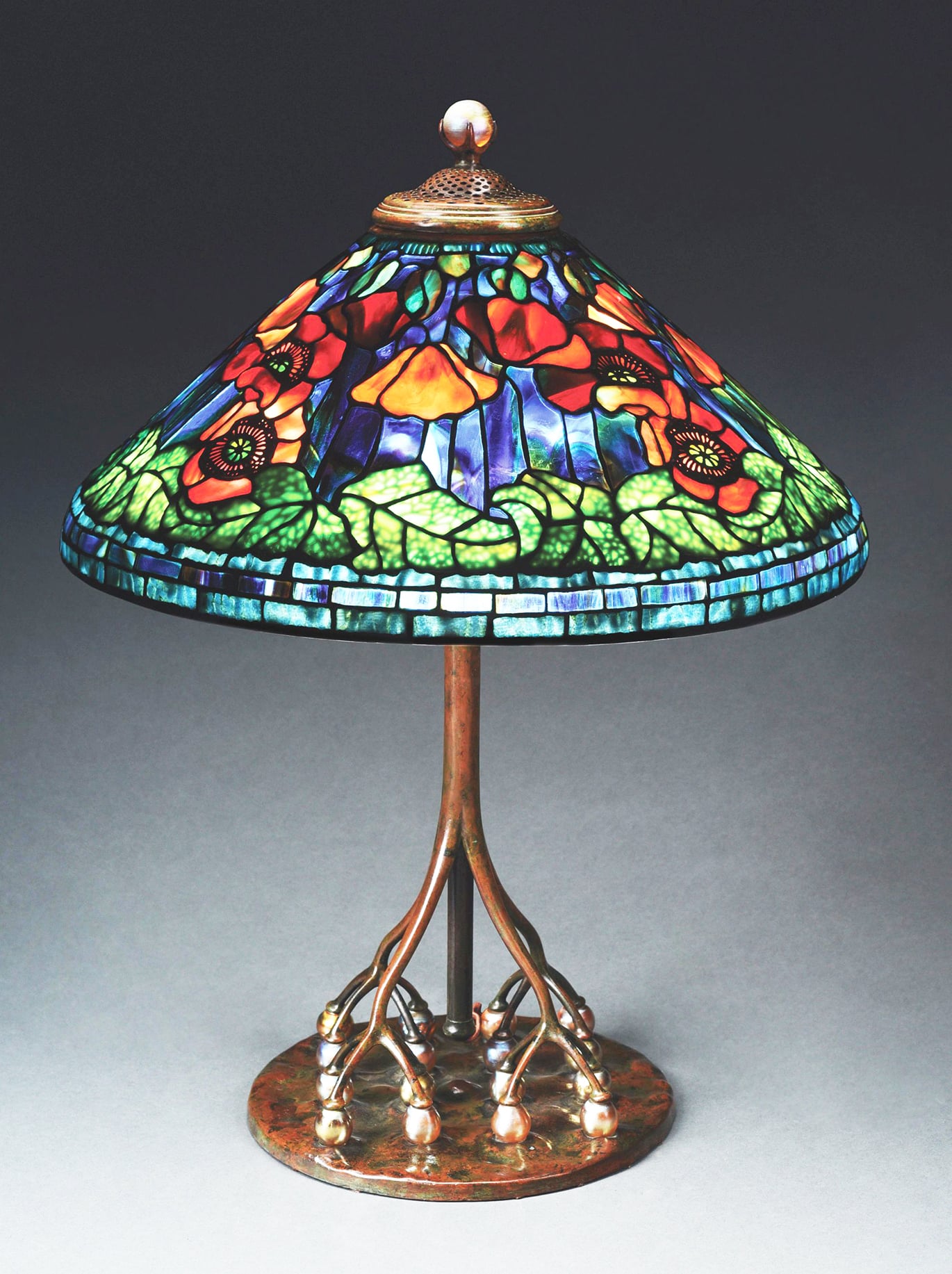A rare, circa 1905-1910 Tiffany Studios Poppy leaded-glass table lamp sold for $541,200 at a Fine & Decorative Arts Auction held June 8-10 by Morphy Auctions in Denver, PA.