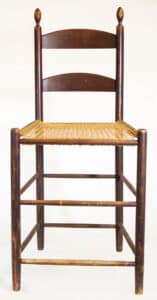 Cherry wood, original dark red walnut-stained finish, two-slat back with beveled top edge, caned seat, double stretchers front, back and sides, probably used in weaving, good overall condition, Enfield, NH, c. 1840, 22” seat h, 41” overall h. Sold for $16,000, June 2022 Willis Henry Shaker Auction