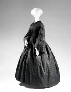 Simple afternoon dress appropriate for “third” or “ordinary” period of mourning from Besson and Son’s Mourning Store of Philadelphia, The Met
