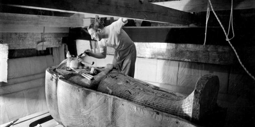 The British archaeologist Howard Carter leaning on the lid of the second coffin in the tomb of Tutankhamen, in October 1925. He had discovered the tomb’s entrance three years earlier.