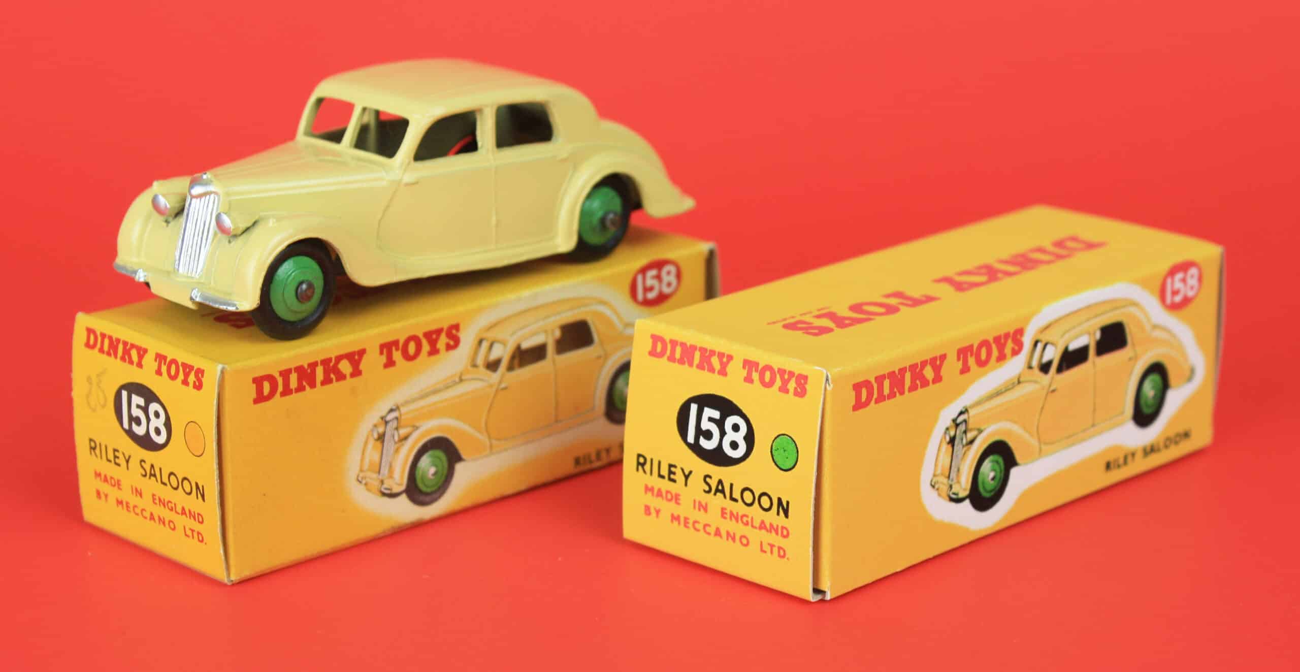 Side by side: Original mid-1950s Dinky Toys Riley with its original box on left, next to a reproduction box made by D.R.R.B.
