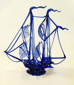 Spun glass ship in navy blue. (Photo by Hank Kuhlmann)