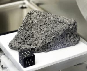 Collected during Apollo 17, a 3.5-billion-year-old basalt rock known as The Children of the World or The Goodwill Sample is displayed in the lunar lab at the NASA Johnson Space Center on Monday, June 17, 2019, in Houston. It was used to make samples that were gifted to every country on earth.