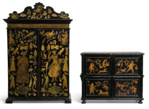 HANS CHRISTIAN ANDERSEN HAND-DECORATED DOLL HOUSE FURNITURE.Miniature chest and wardrobe, black painted wood decorated with gilt lacquer cut-outs featuring fantastical motifs by Hans Christian Andersen for his god-children in the family of Jonna Stampe (nee Drewsen), the eldest grand-daughter of his benefactor Jonas Collin