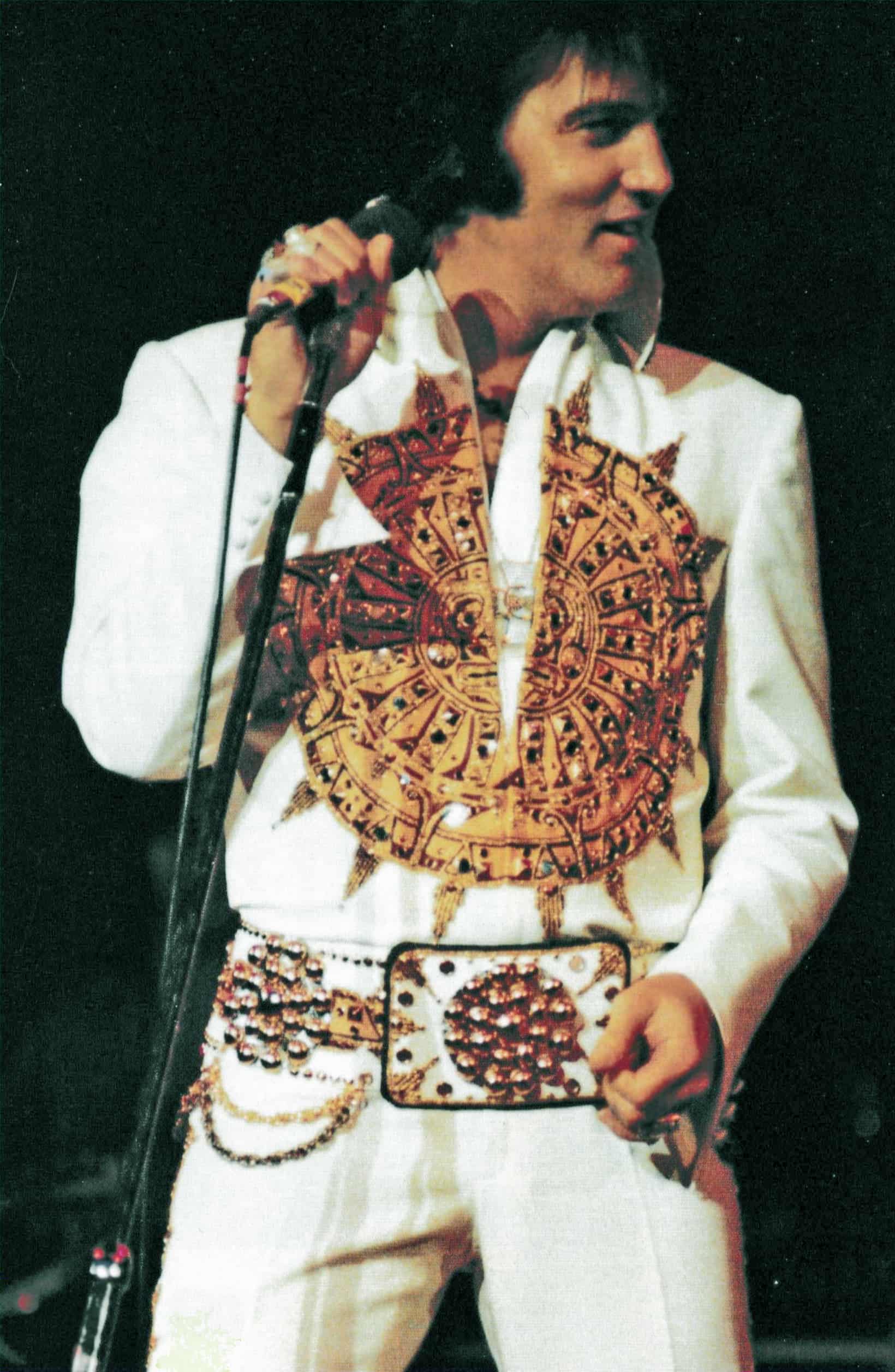 Elvis wearing Mexican sundial jumpsuit