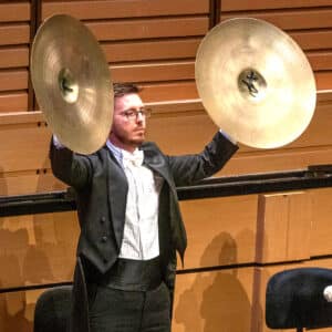 Playing cymbals in the Queensland Symphony Orchestra