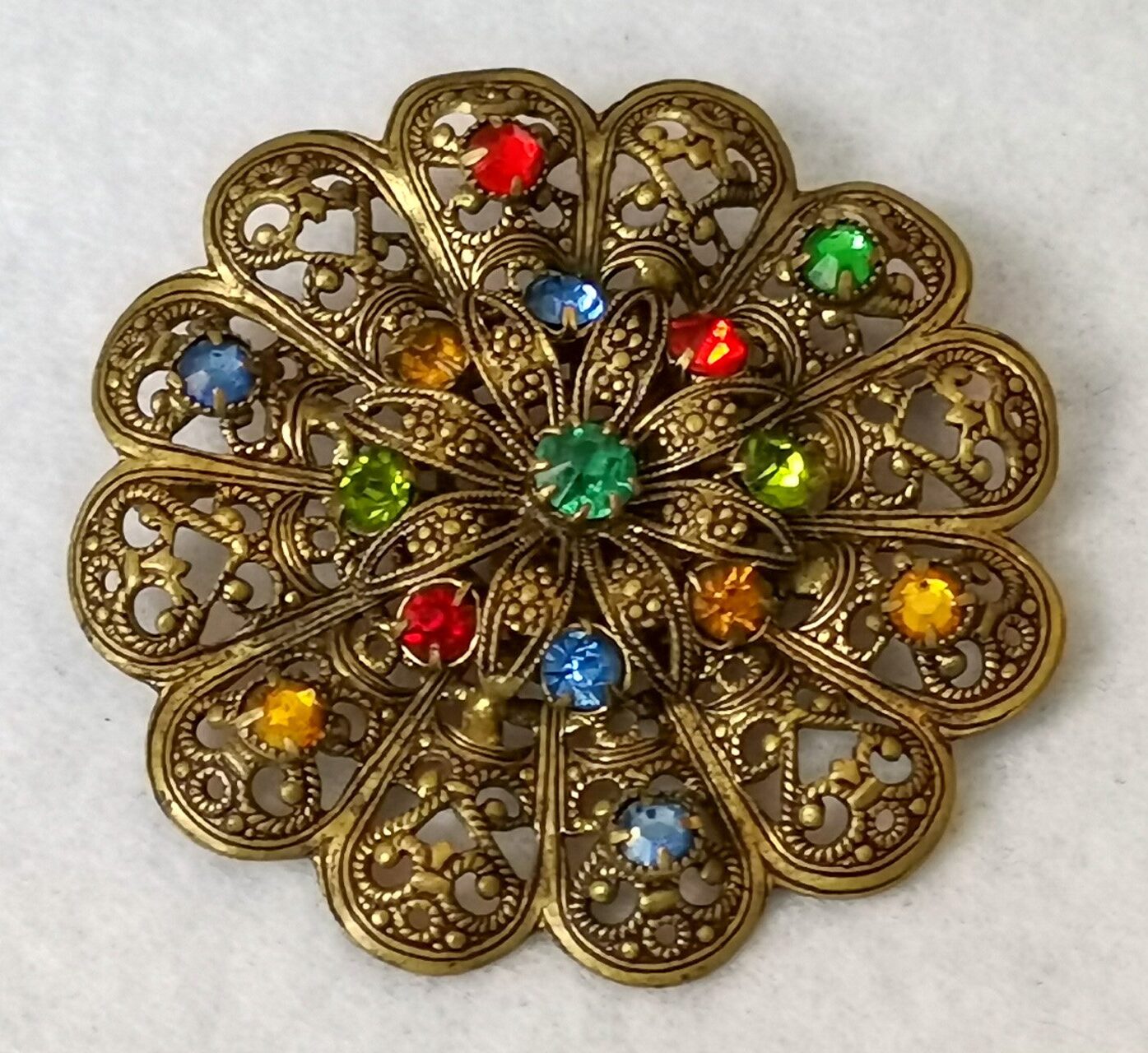 Czechoslovakian Edwardian era filigree harlequin glass brooch.