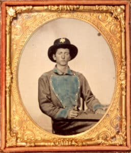 Lafayette Meeks, whose tomb at Appomattox Court House was placed under a red cedar tree, is shown here wearing a Cavalry bib shirt, ca. 1865.