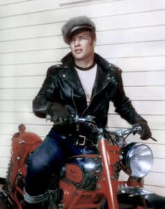 Below: Actor Marlon Brando rides a Triumph motorcycle in a scene from the movie The Wild One, released in 1953. Jeans were clean-cut but cool. Hollywood embraced them rapidly in the post-war era.
