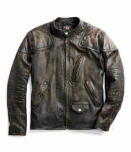 At right: Inspired by a late-1940s motorcycle jacket from Mr. Lauren’s personal collection, this 1970s vintage jacket is made from vegetable-tanned cowhide with a black-over-brown hue. Distressed finish achieved through a multistep process that allows the piece to continue to age with wear. Padded shoulder and elbow patches. Café racer–style stand collar. Fully lined with twill. Selling online for $2,290 at uncommon-threadz.com