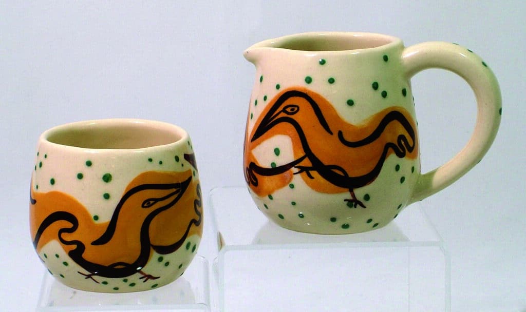 YCH 7:  Sugar and creamer with bird motif, 1953. 2-3/4” h.; 3-1/2” h. $25-35/pr.