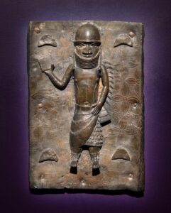 Benin artist, Benin Plaque, 1550–1650. Bronze; 20 1/4 in. x 14 1/8 in. Work loaned out by the National Commission for Museums and Monuments of Nigeria in Support of the International Friendship Being Fostered through this Exhibition.