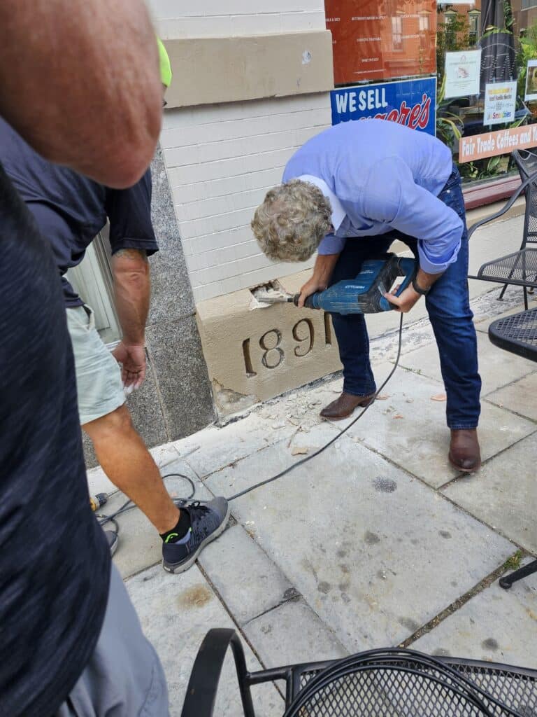 Building owner Lou Pektor, 
at work with the demolition hammer.