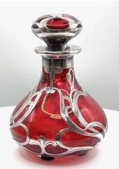 Outstanding collector's item ruby silver overlay perfume bottle with top engraved “Mardi Gras 1903” 4 inches tall