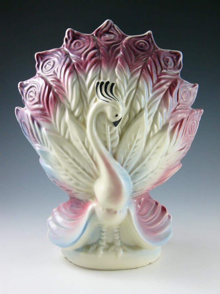 Peacock shows off his feathers, hiding the bulb behind them.