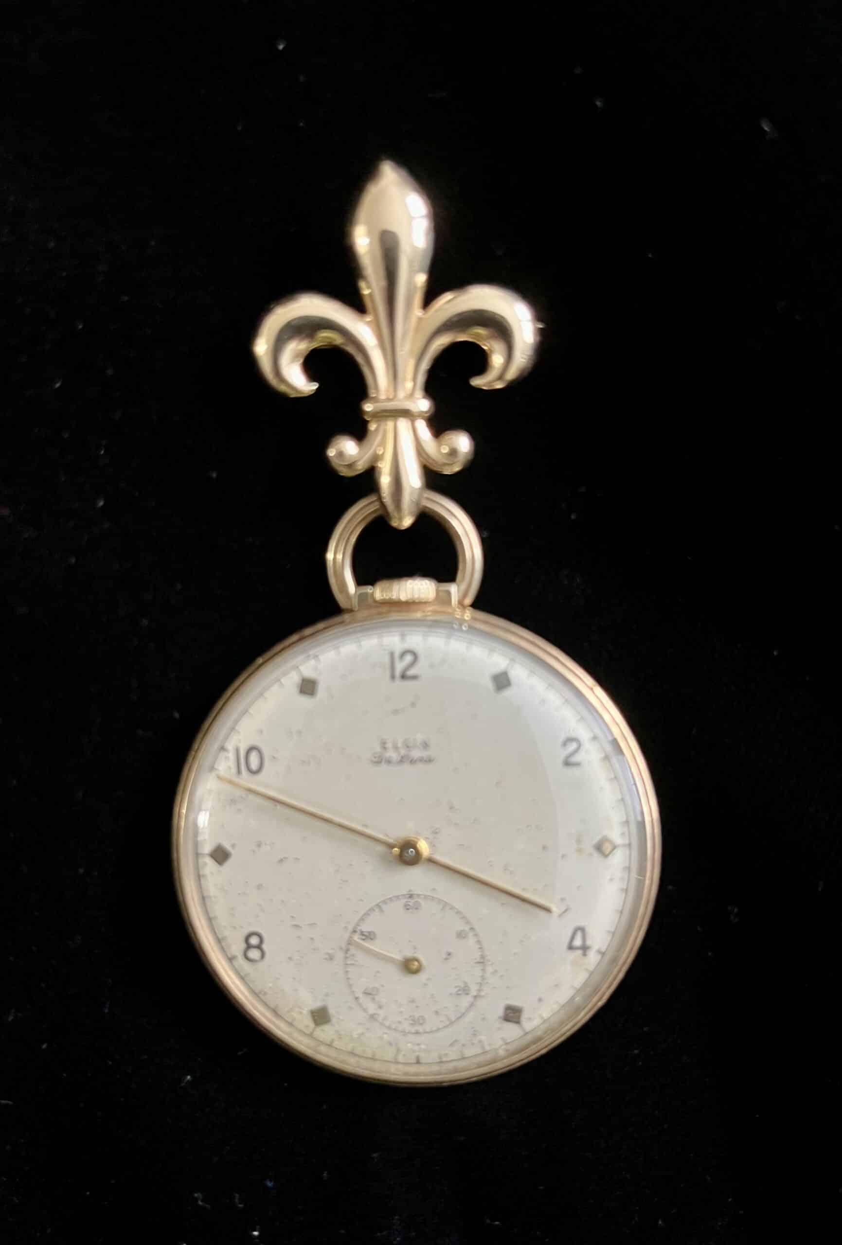 A gentleman’s pocket watch need not sit in a drawer, thanks to the purchase of a fleur-de-lis brooch.