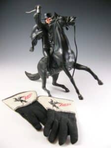 Mementos of a happy childhood: Wayne Babchuk’s “Zorro” gloves and figurine.