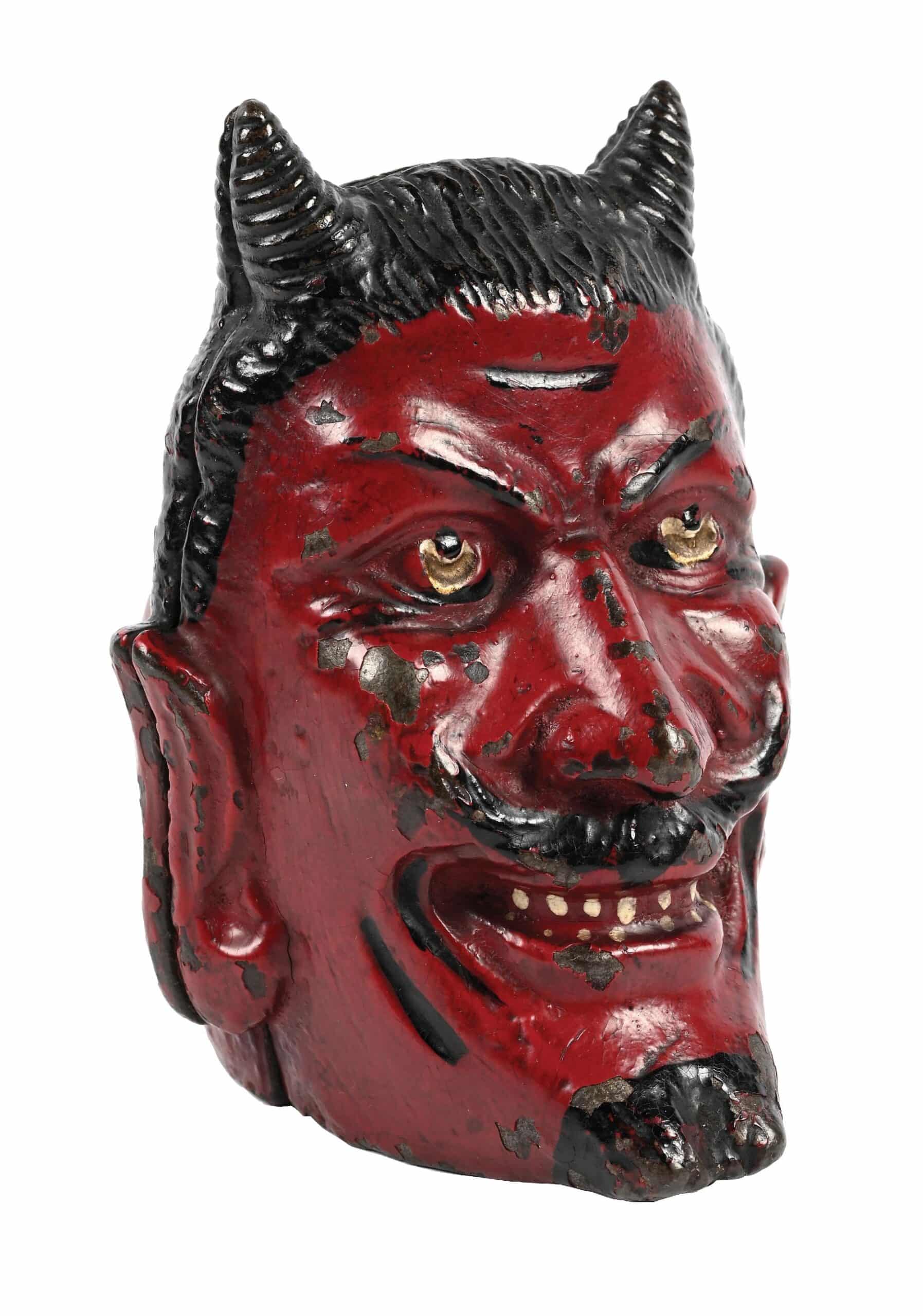 Two-faced cast-iron devil still bank by A C Williams, near-mint condition